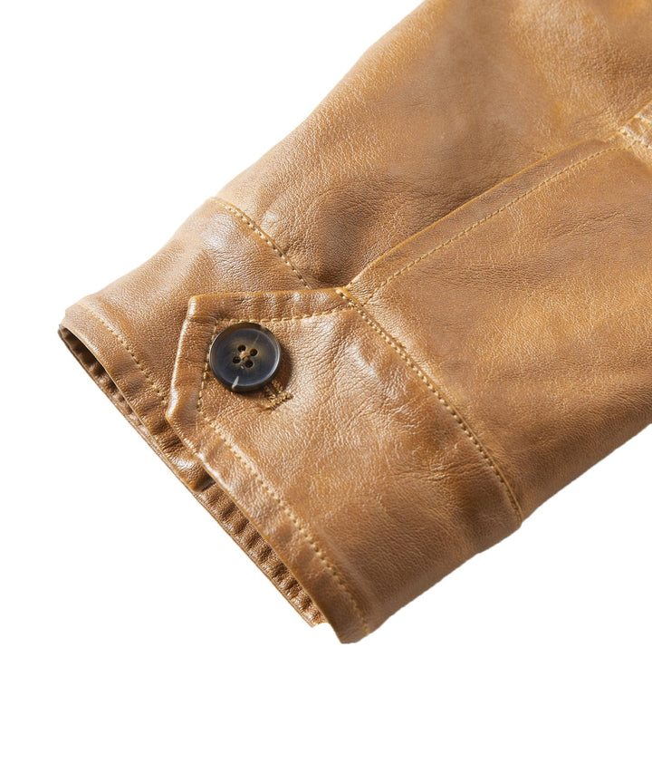 Man in Men's Pioneer PU Leather Jacket smiling, depicting comfortable and rugged menswear fashion