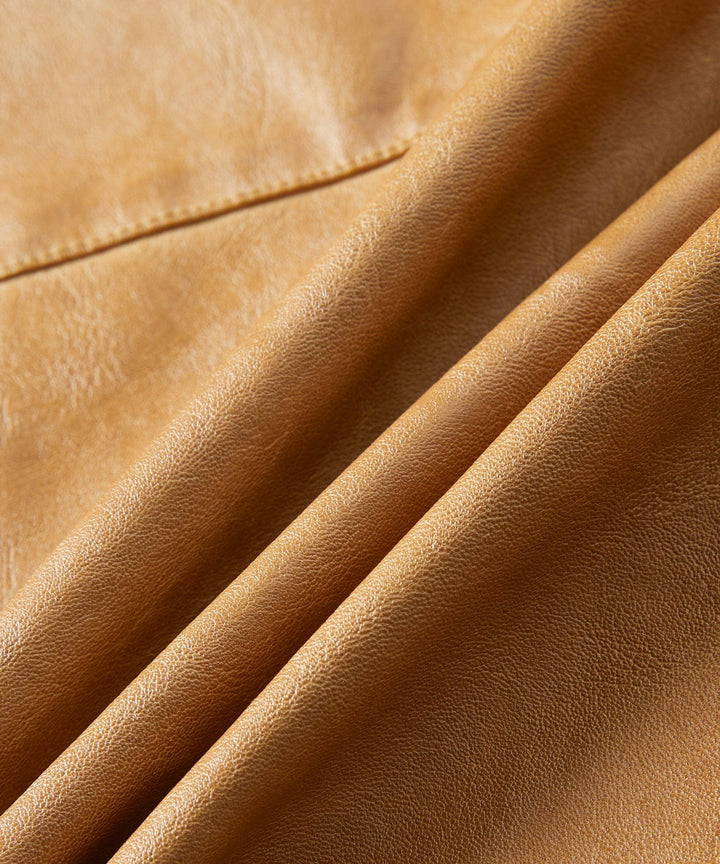 Lifestyle shot of Men's Pioneer PU Leather Jacket in an outdoor setting, classic fall outerwear