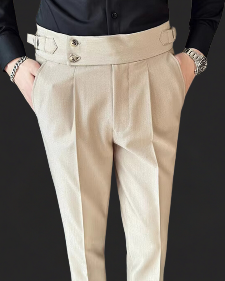 Man wearing classic pleated Gurkha dress trousers. Adjustable waist offers perfect fit for formal & smart casual outfits.