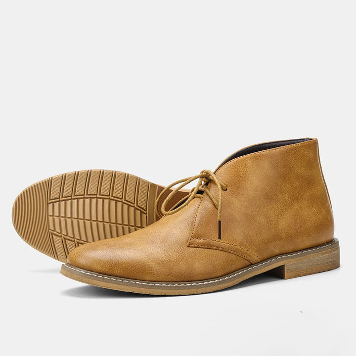 Formal men's polished leather lace-up boots, showcasing a sleek design and quality craftsmanship.