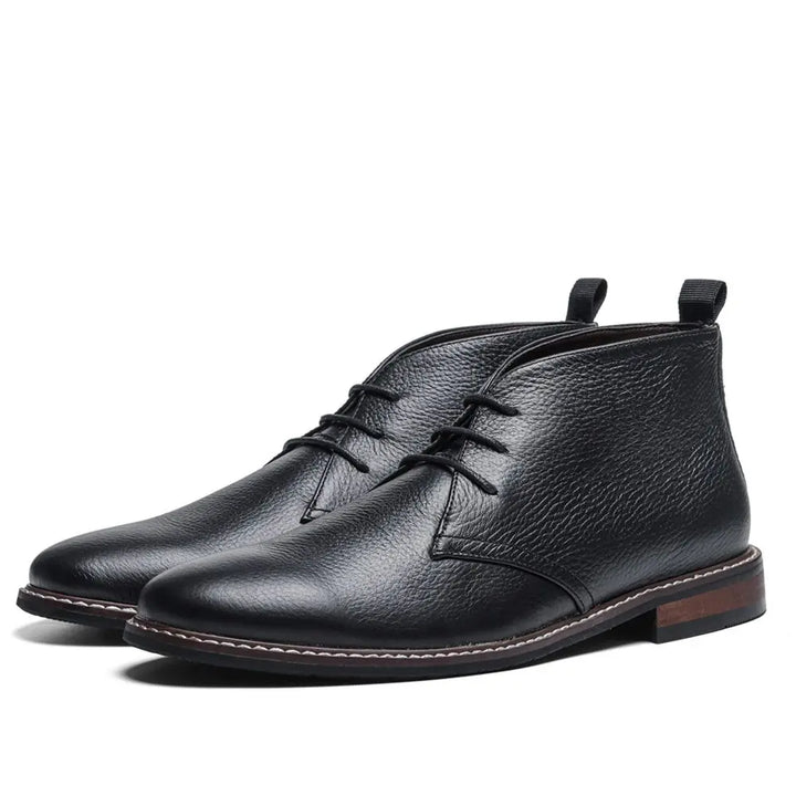 Classic men's dress boots in polished black leather, a versatile footwear choice for fashion-conscious men.