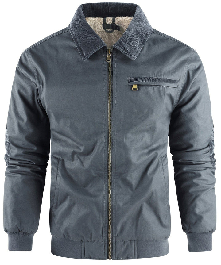 Detail of the zipper and collar on a men's black bomber winter coat