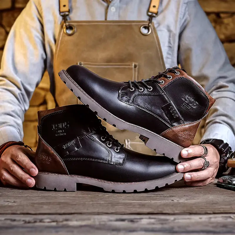 Close-up of men's black leather dress boots, showcasing the high-quality material and stitching