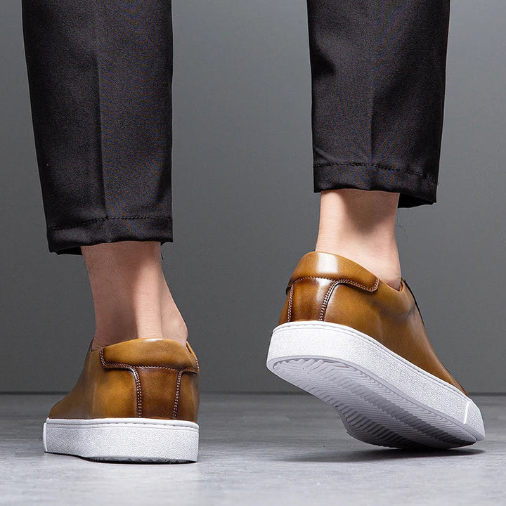 Collection of men's leather casual sneakers, showcasing diverse colors & minimalist design