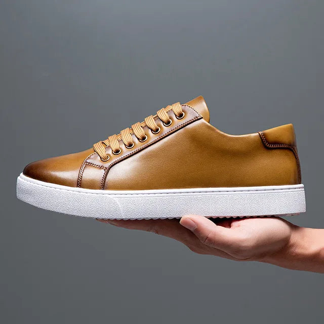 Close-up of men's genuine leather sneakers in tan, versatile casual footwear for street style