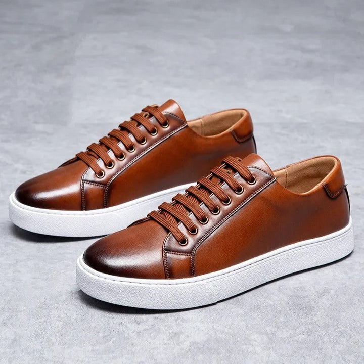 Detail of stitching on men's brown leather sneakers, high quality genuine leather shoes
