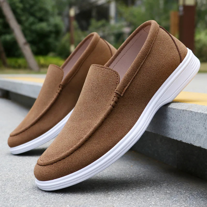 Stylish gray suede slip-on loafers for men, featuring superior comfort and versatile fashion appeal.