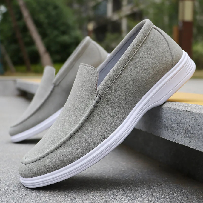 Fashionable men's gray suede loafers, a premium choice for versatile styling in comfort and sophistication.