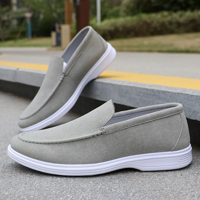Pair of men's blue suede loafers, showcasing the rich color and slip-on design for easy wear.