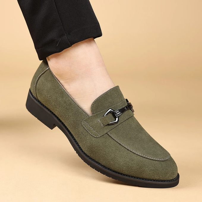 Textured close-up of the velvet-like suede on men's slip-on loafers.