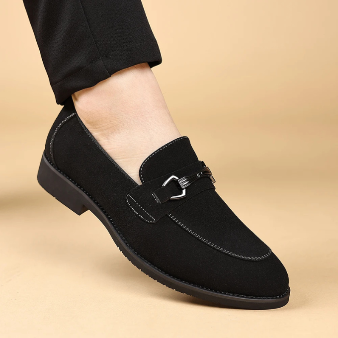 Men's suede loafers with a sleek profile, perfect for smart casual and elegant fashion.