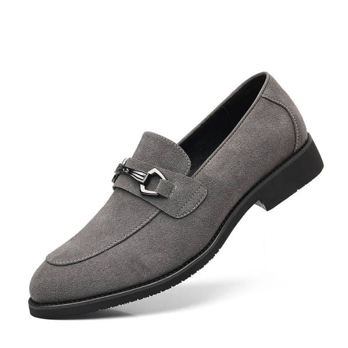 Close-up of the stitching on men's black suede slip-on loafers, high-quality finish.