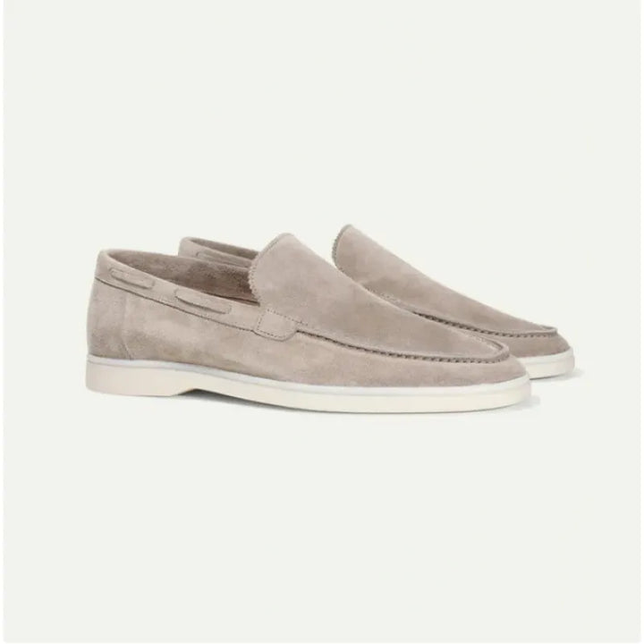 Side view of a men's premium tan suede slip-on loafer, highlighting minimalist design and quality material.