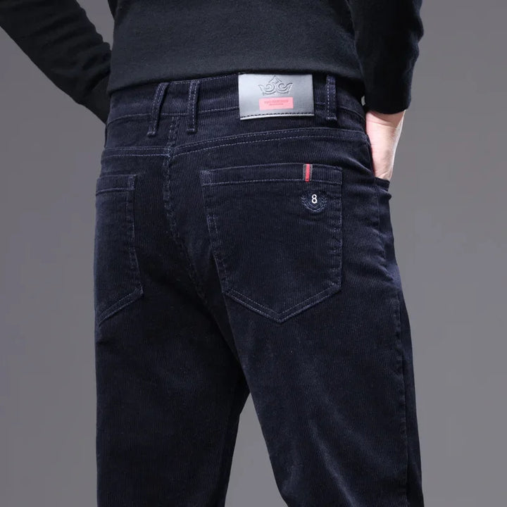 Men's tailored corduroy bottoms in a sophisticated grey, offering a comfortable yet formal workwear option.