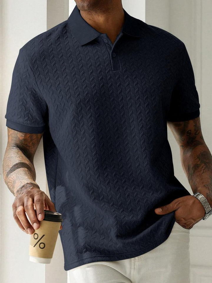 Comfortable men's apparel: a breathable cotton blend polo with a textured surface, ideal for daily wear