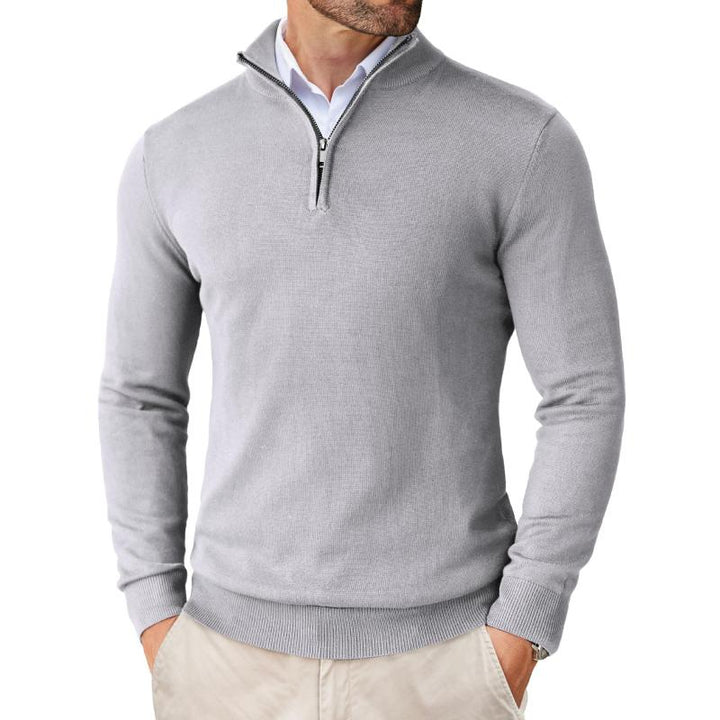 Close-up of men's quarter-zip knit sweater, showcasing fine cotton-merino wool blend texture
