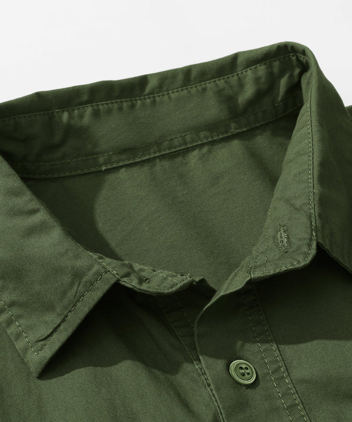 Close-up of the brand tag inside the Men's Premium Cotton Terrain Trek Shirt, quality men's apparel.