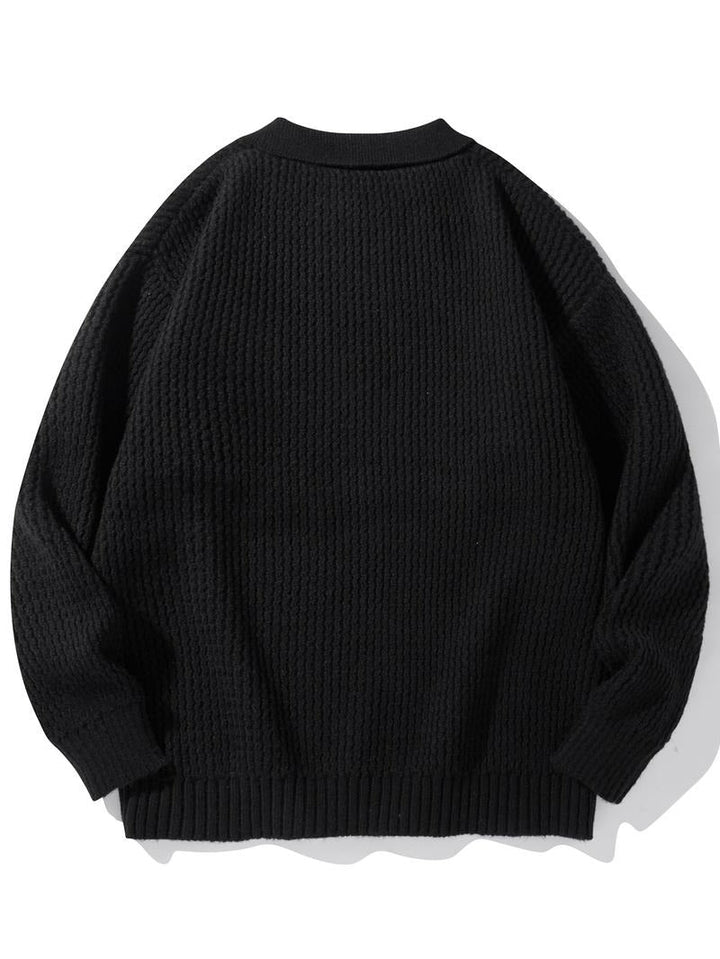 Stylish men's knit polo sweater in a rich color, featuring a textured design and classic collar.
