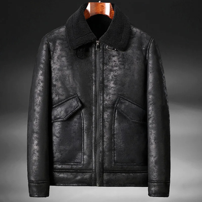 Stack of folded men's leather aviator jackets, showcasing different sizes and premium leather