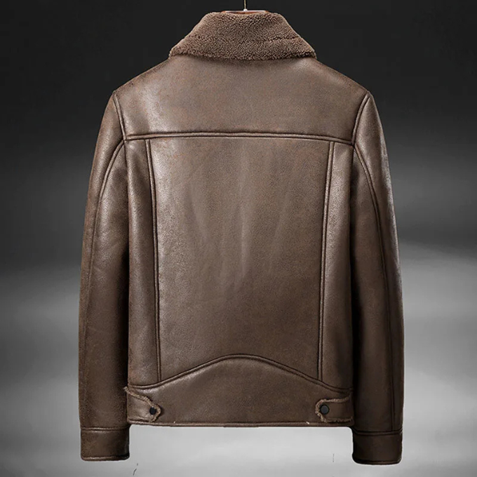 Full shot of a man wearing a brown leather aviator jacket, showcasing its fashionable fit and style