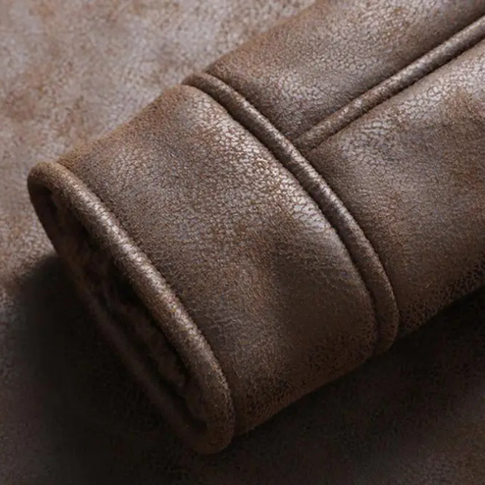 Close-up of the robust zipper on a men's winter leather coat, built for durability