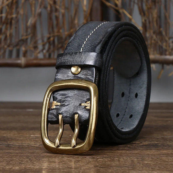 Handcrafted men's cowhide leather belt, emphasizing the natural grain and sturdy brass hardware