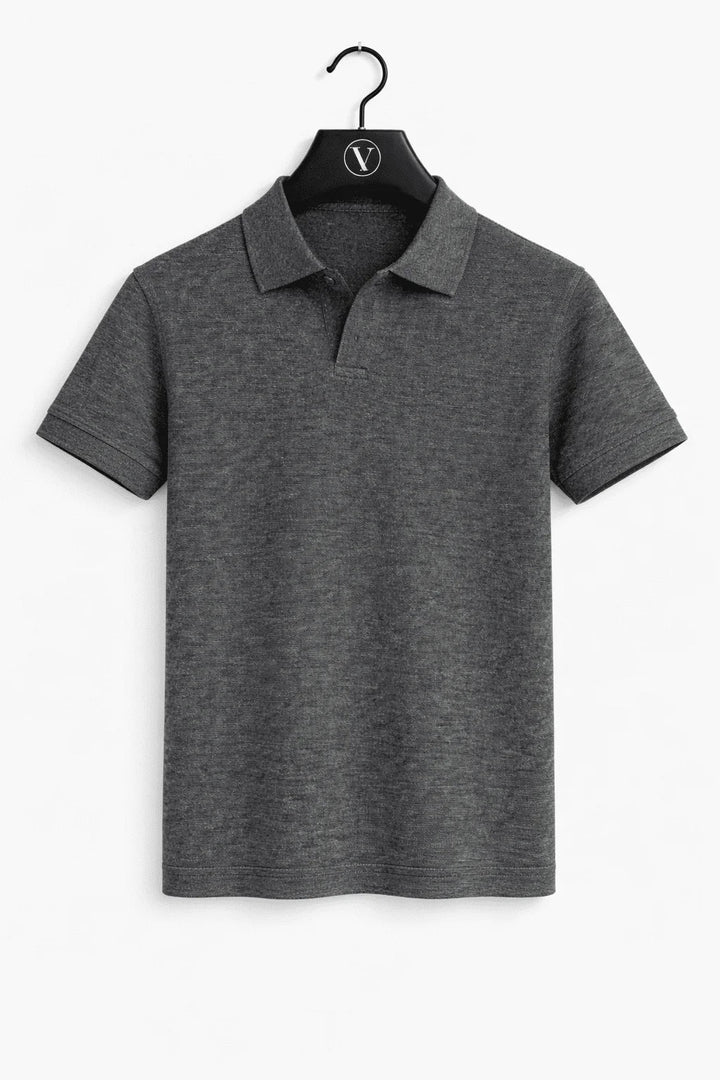 Close-up of premium pique fabric on a men's tailored fit polo shirt, highlighting texture.