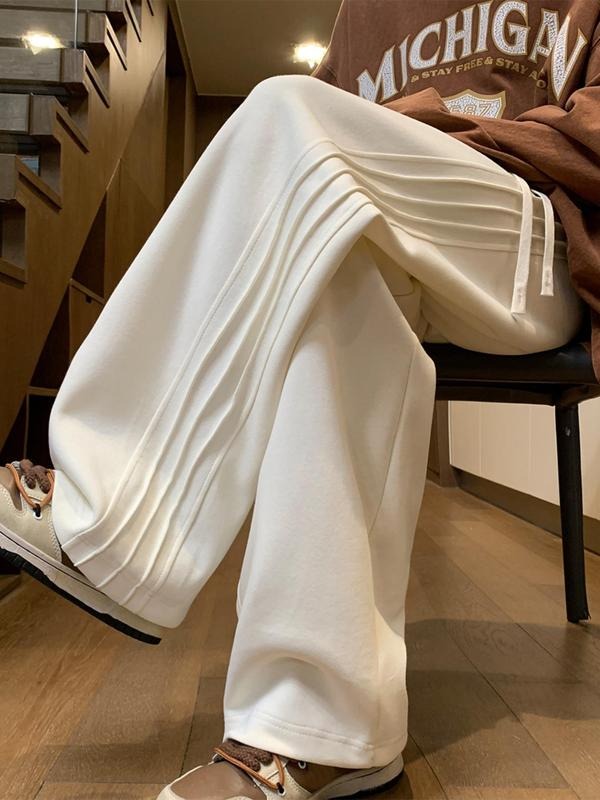 Men's wide-leg track pants in a soft cotton blend, perfect for athletic activities or casual wear