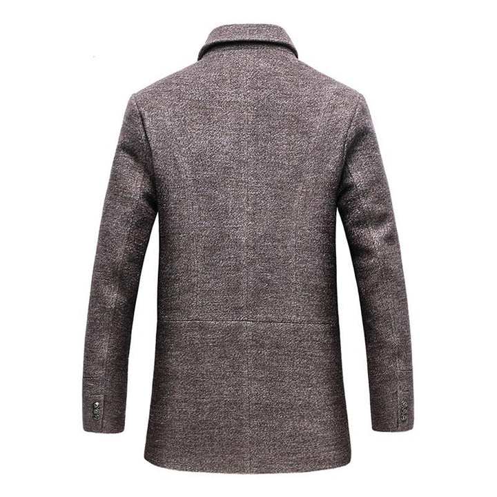 Close-up of the textured wool fabric of a men's winter coat, showing fine detail and quality