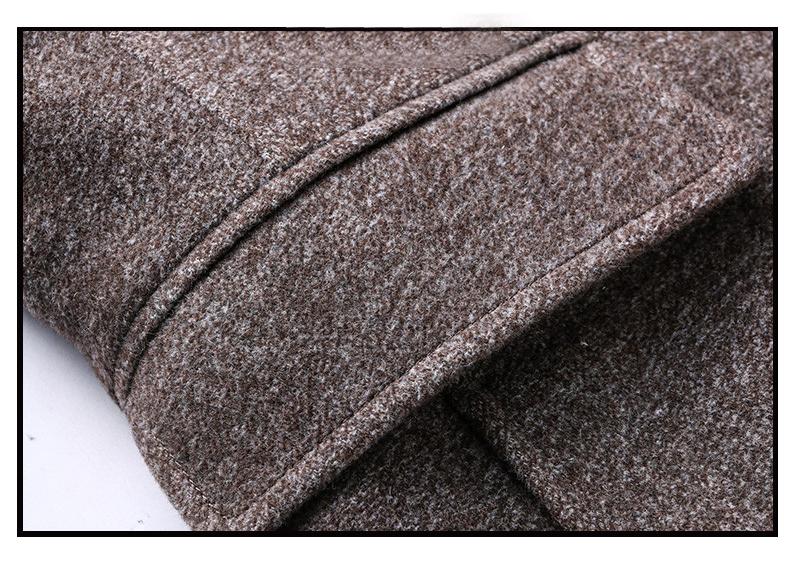 Man wearing a dark men's wool coat with the detachable scarf attached, styled for smart casual