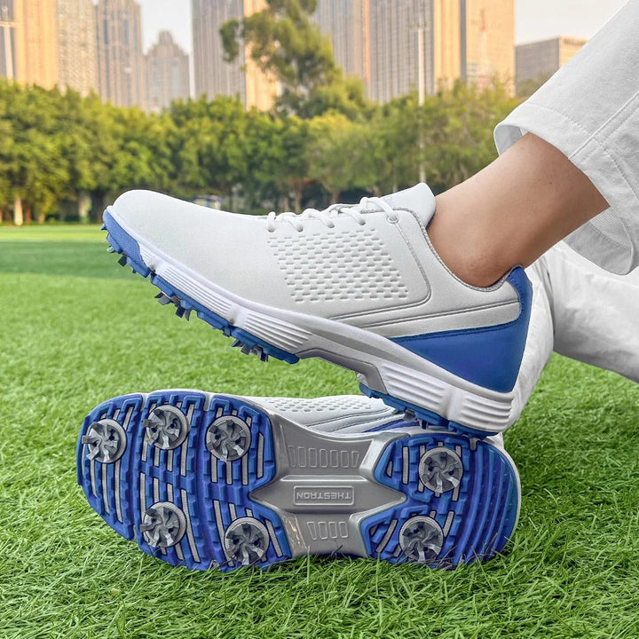 Water-resistant blackout men's golf footwear, keeping feet dry on wet courses.