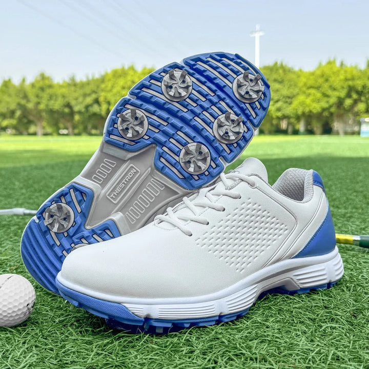 White men's spiked golf shoes, crafted from premium leather for durability & clean style.