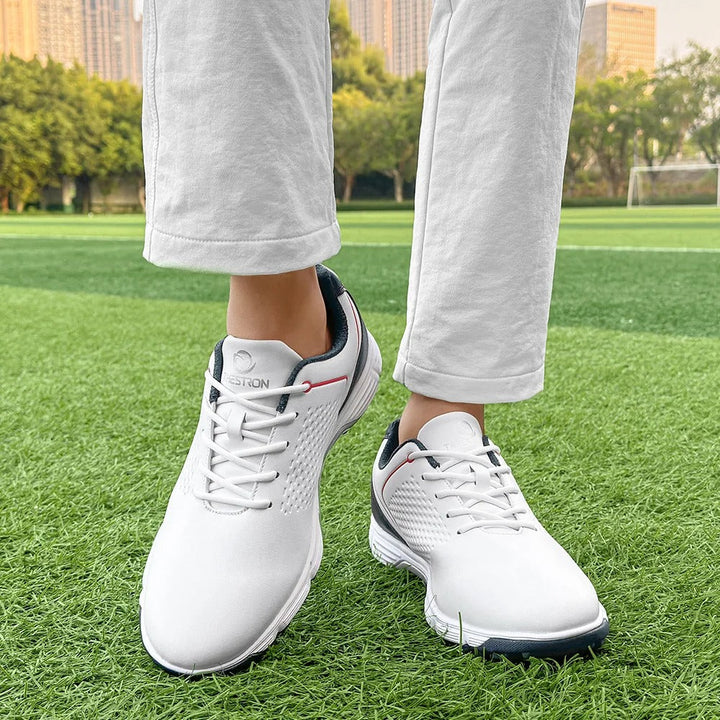Spiked men's golf footwear in white, providing excellent traction and a fresh aesthetic.