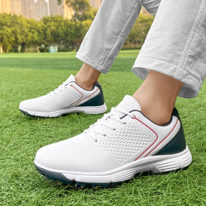White leather golf shoes for men, featuring a comfortable and secure fit on the green.