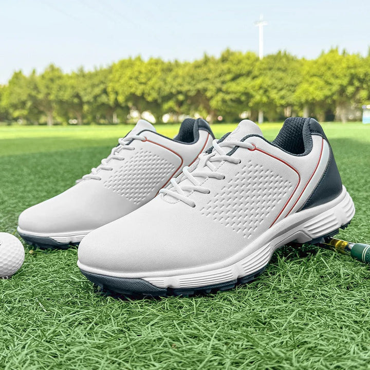 Men's golf shoes, white, with advanced spike technology for superior grip.
