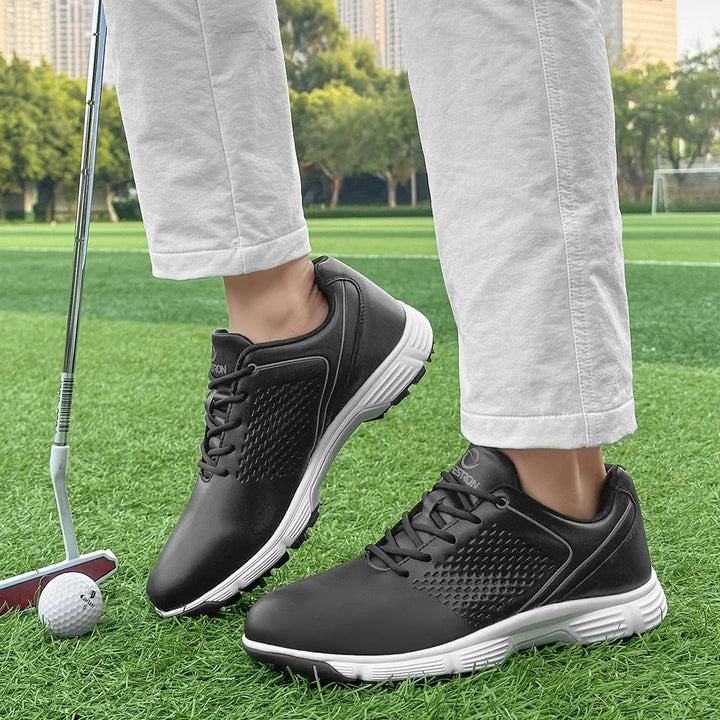 Water-resistant men's pro golf shoes in blackout, perfect for all weather conditions.
