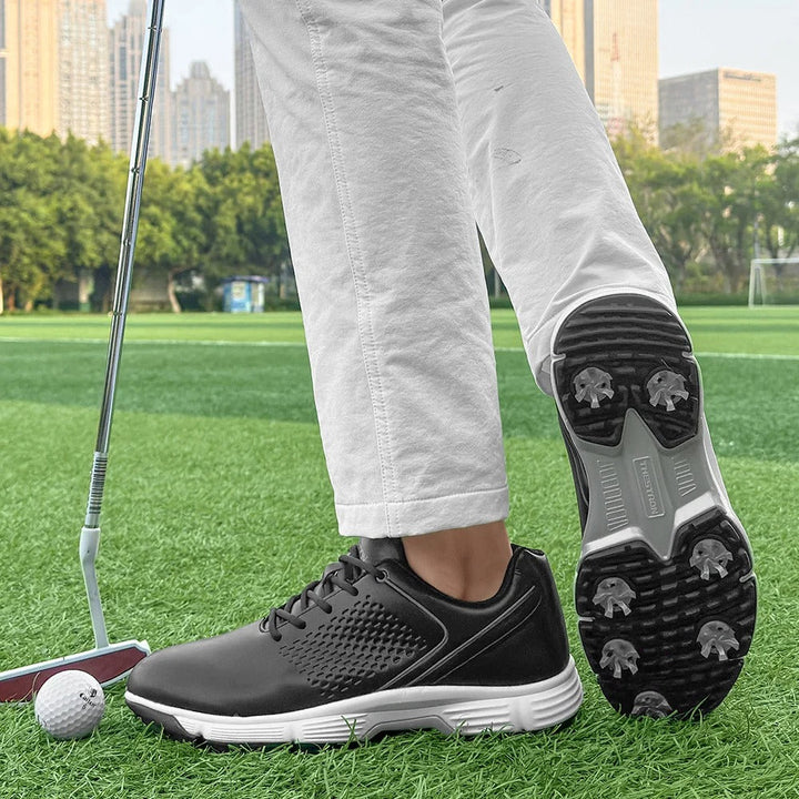 Spiked men's golf footwear in blackout, providing excellent traction and support.