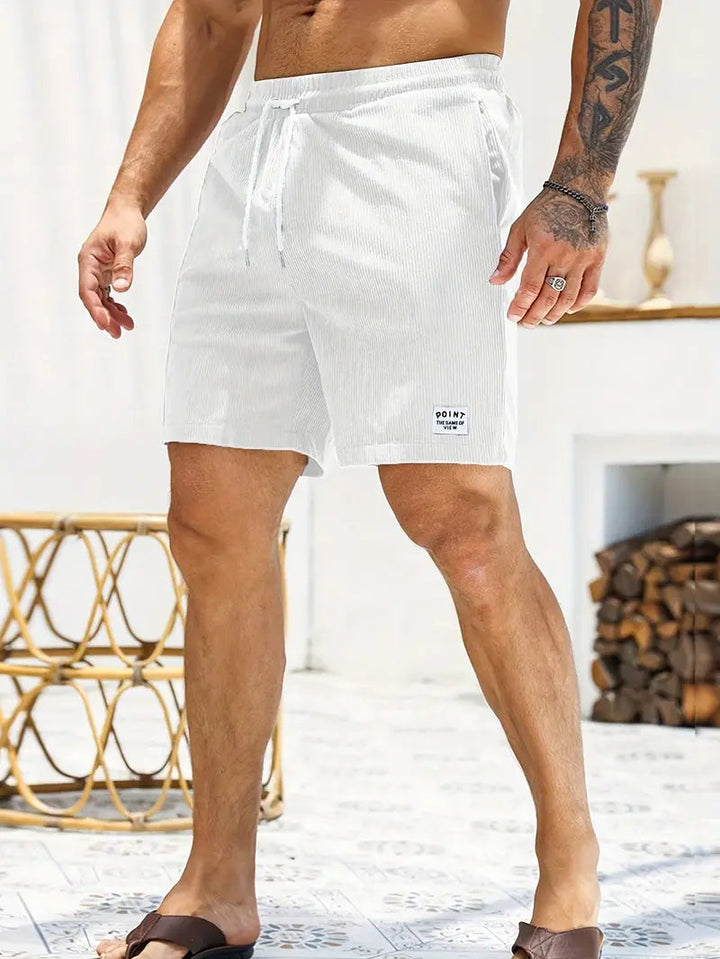 Men's quick-dry vacation swim shorts, ready for the resort or a casual day out.