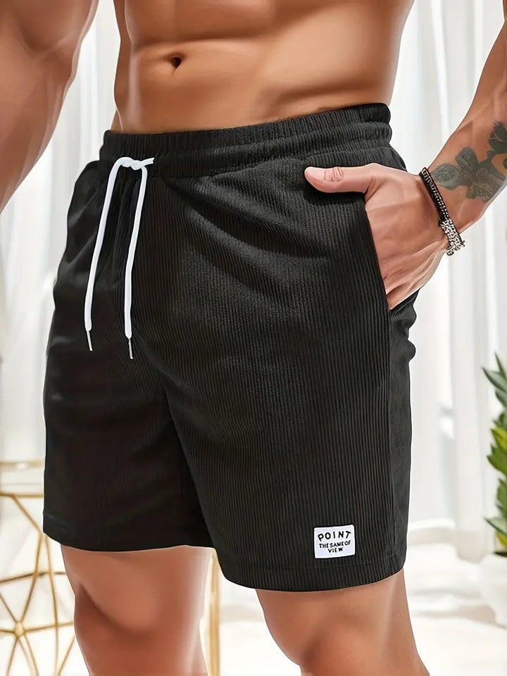 High-quality men's quick-dry swim shorts, a staple for any summer wardrobe.