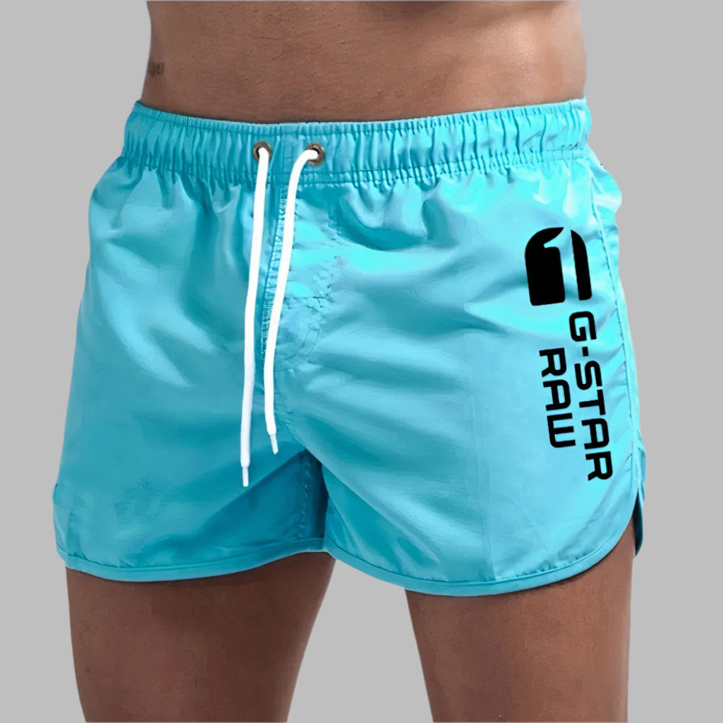 Men's quick dry swim trunks, ideal for beach, pool, or athletic wear. Solid color, comfortable fit.