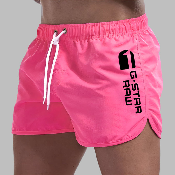 Comfortable men's solid color quick-dry swim trunks, perfect for swimming, beach, or casual summer outings.