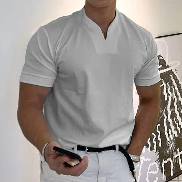 Man wearing a quick-dry V-neck athletic t-shirt during a summer workout. Comfortable short-sleeve activewear top.