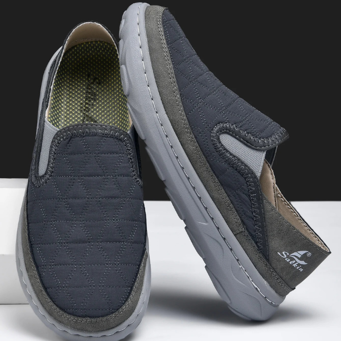 Classic black men's slip-on shoes, quilted for extra softness and comfort