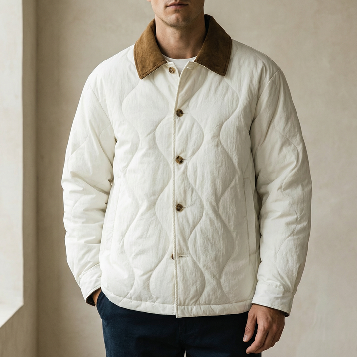 Stylish men's quilted jacket featuring a corduroy collar and practical front pockets, ideal for everyday wear