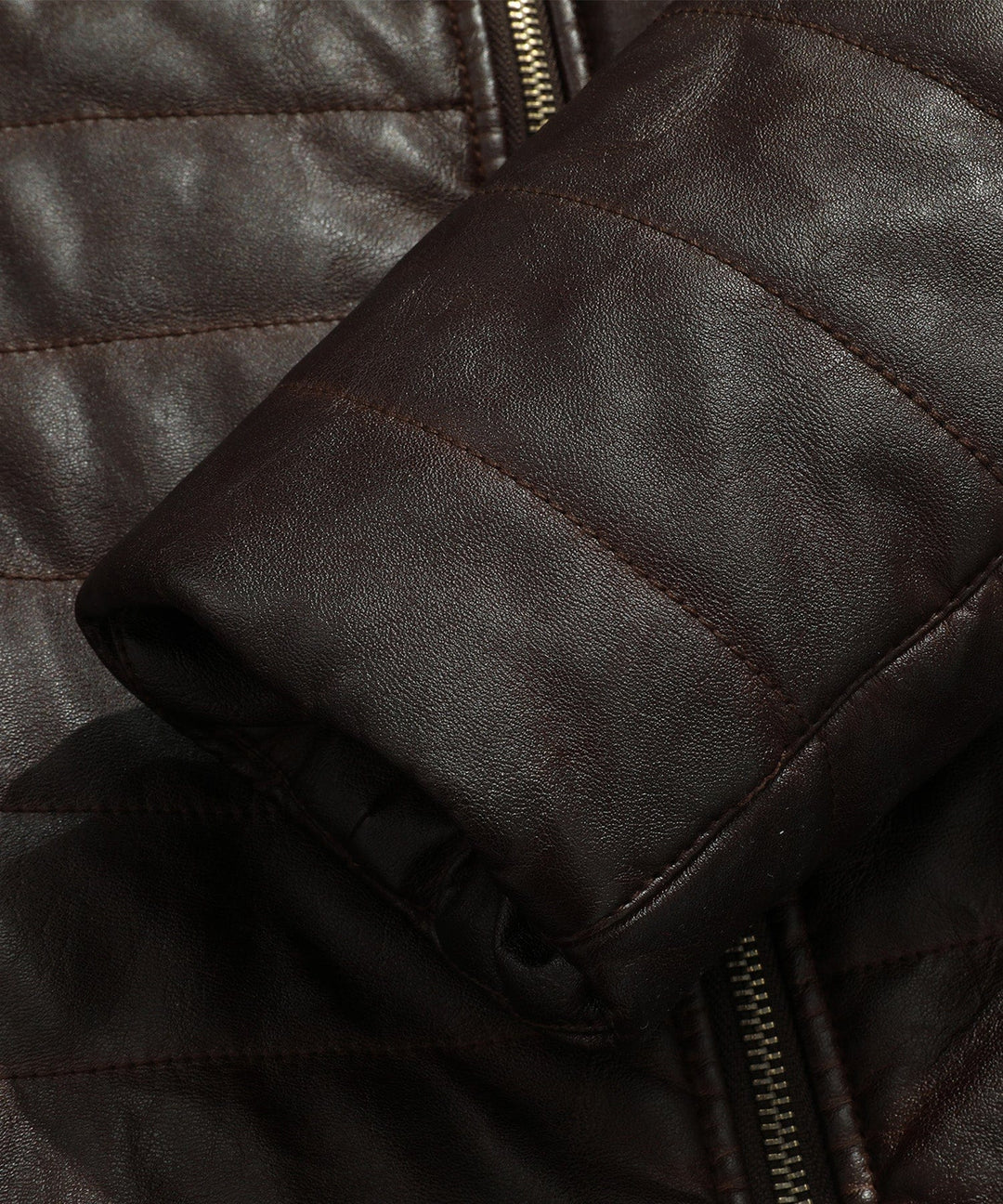 Close-up of the sleeve cuff on the men's brown quilted faux leather jacket