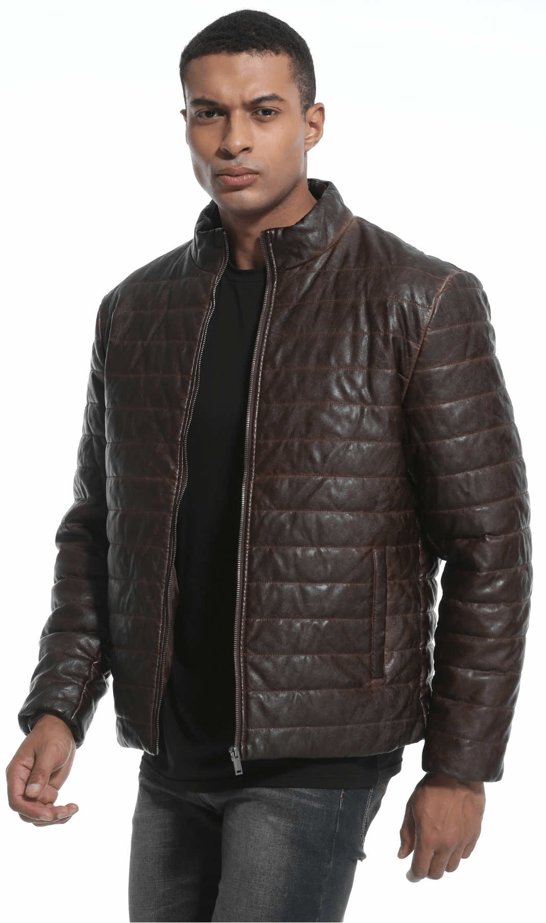 Full shot of a man wearing the versatile brown quilted faux leather jacket, showcasing its fit