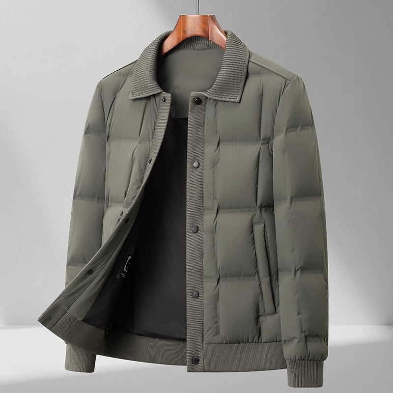 Close-up of quilted pattern on men's relaxed fit puffer jacket with snap closure details