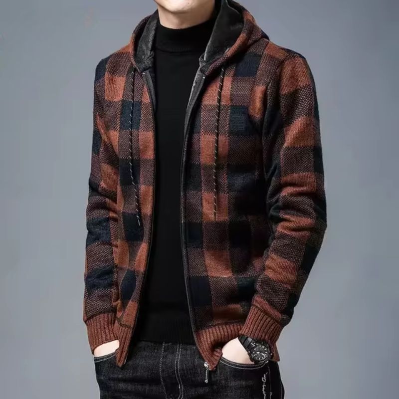 Man wearing a gray and black checked flannel zip hoodie, layered for warmth