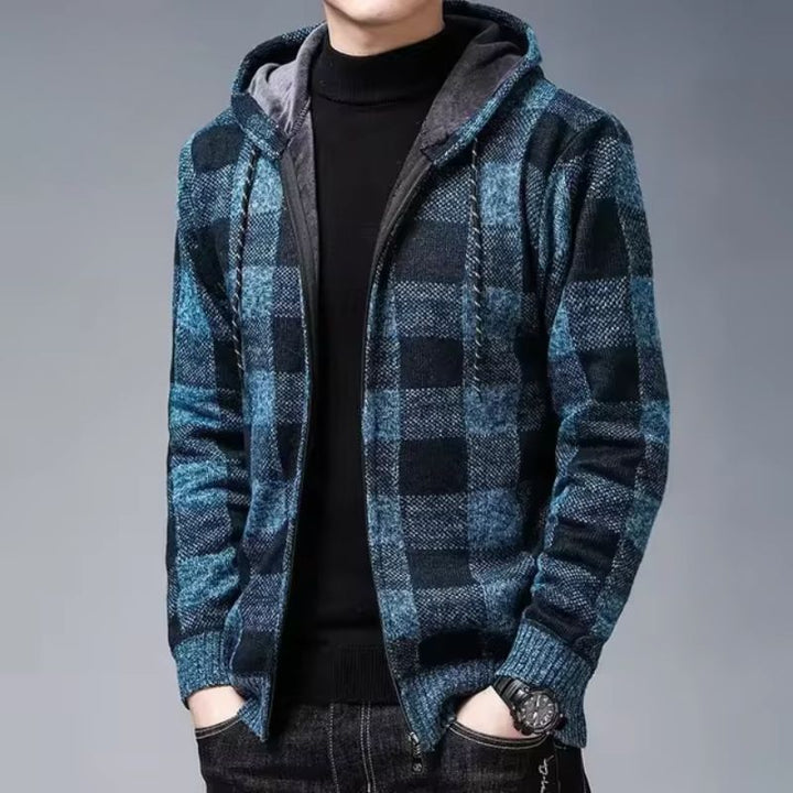 Detailed view of the zipper on a men's green checked flannel hoodie outerwear