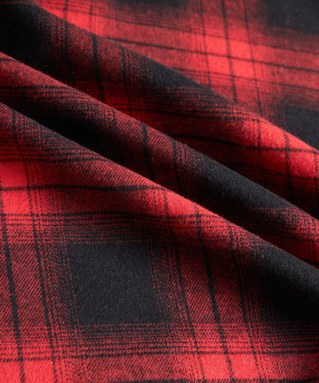 Winter-ready men's jacket: red plaid flannel, sherpa lined hood, offering warmth and comfort